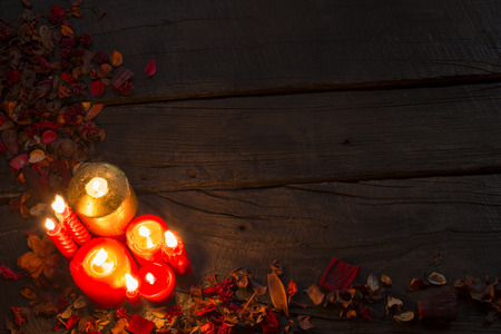 Red candle on dark background, space for textの写真素材