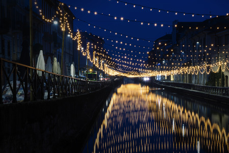 Milan, Italy: The Naviglio Grande canal waterway with Christmas light, night view. This district is famous for its restaurants, cafes, pubs and nightlife.のeditorial素材
