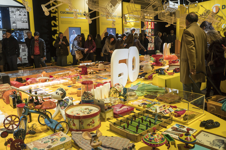Milan, Italy - January 07, 2018: visitors to the exhibition that celebrates the 60th anniversary of Esselunga supermarkets. People observe typical objects of the 60s.のeditorial素材