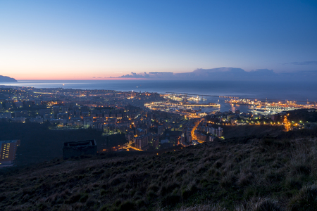Night panorama of Genoa, Italy. The view from the hills surrounding the city.の写真素材