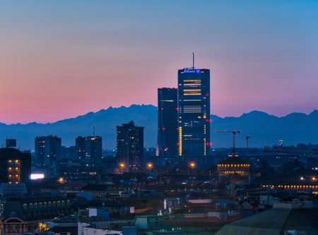 Milan, Italy - January 13, 2018: The new skyscrapers in CityLife district and the Monte Rosa mountain on the background. Sunset view.のeditorial素材