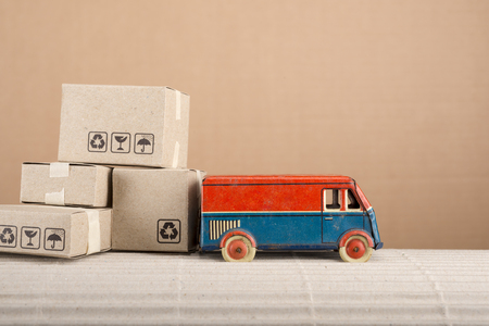 Vintage toy truck with cardboard boxes. Shipping and delivery concept.の写真素材