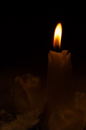 Soft light of a candle, captured in the churchの写真素材