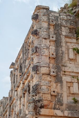 Decorations of a Mayan Temple, depicting men elephants, in the archaeological area of Uxmal, in the Mexican Yucatan Peninsulaの写真素材