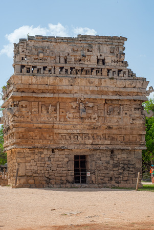 Small Mayan temple, adorned with engraved stones, in the archaeological area of Chichen Itza, on the Yucatan peninsulaの写真素材