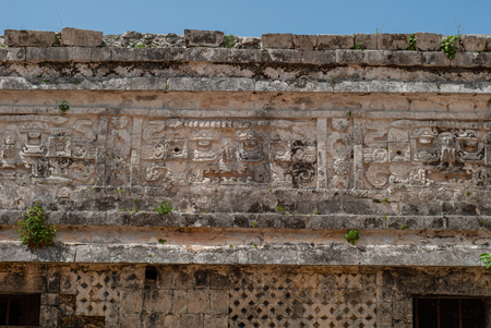 Detail of stone carvings of a Mayan temple, in the archaeological area of Chichen Itza, on the Yucatan peninsulaの写真素材