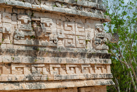 Decoration details engraved on the Mayan temple, in the archaeological area of Chichen Itza, on the Yucatan peninsulaの写真素材