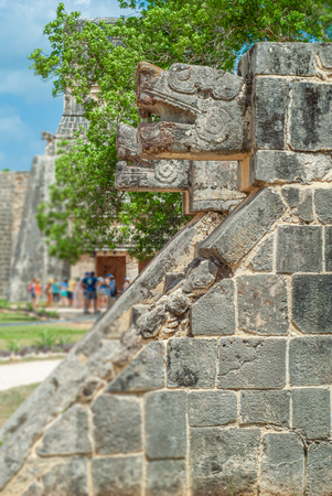 Stone ornaments, in the shape of snake heads, in the archaeological area of Chichen Itza, in the Yucatan peninsulaの写真素材