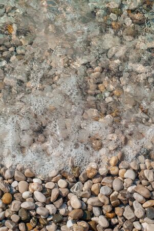 Stones eroded by the waves of the sea, of various colors and shapes, taken in Nerano, near Sorrentoの写真素材