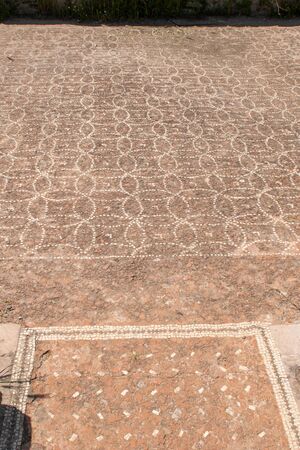 Taking of a floor formed by a mosaic of stones, found in the archaeological area of Paestumの写真素材