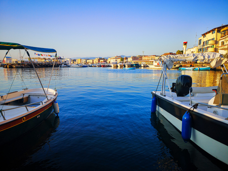 Port of Castellammare di Stabia, with a view of boats and the buildings of the waterfront, taken on a summer dayのeditorial素材