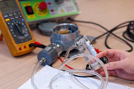 Man work in laboratory on the air sensor for calibrate itの写真素材