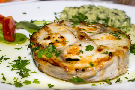 A dish of grilled medallion Swordfishの写真素材