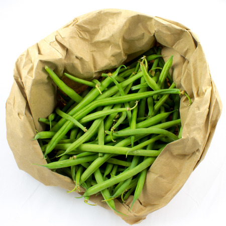 Whole green beans in a paper bagの写真素材