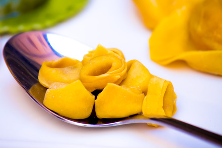 close-up of a spoon with tortellini,  typical pasta of Bologna, Italyの写真素材