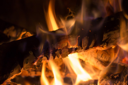 closeup of burning wood in a fireplaceの写真素材