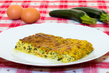 closeup of a zucchini pudding on a laid tableの写真素材
