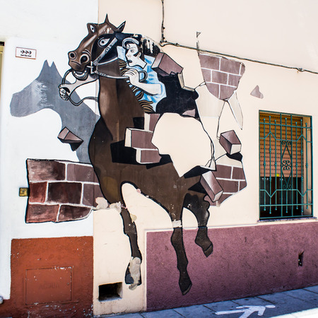 ORGOSOLO, ITALY - JUNE 26, 2015 - typical wall paintings on the streets of Orgosolo, a small town in Sardinia, Italyのeditorial素材