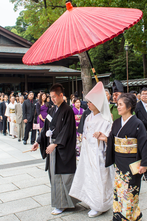 TOKYO, JAPAN - OCTOBER 10, 2015: Celebration of a typical Shinto wedding at Meiji Jingu Shrine in Tokyo, Japan.のeditorial素材