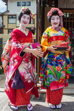 KYOTO, JAPAN - OCTOBER 14, 2015 : portrait of two smiling Maiko, Apprentices geisha, in Kyoto, Japan.のeditorial素材