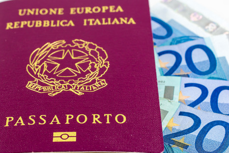 Italian passport on some banknotes of twenty euroの写真素材