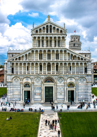 PISA, Italy - April 22, 2014 -  The medieval cathedral of the Archdiocese of Pisa, dedicated to Santa Maria Assunta, The heart of the Piazza dei Miracoli,with the Leaning Tower in Pisa,  Italyのeditorial素材