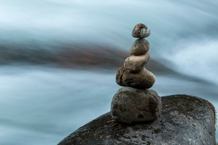 Stones in a zen position in a river in Costa Ricaの写真素材