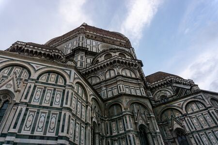 Details of Cathedral of Saint Mary of the Flower, called Cattedrale di Santa Maria del Fiore in Florence Tuscany from Uffizi Gallery. Also known Cathedral of Florence or Duomo Di Firenze.の写真素材