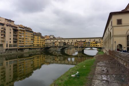Ponte Vecchio the famous Arch bridge in Florence on Arno river, Tuscany, Italyの写真素材