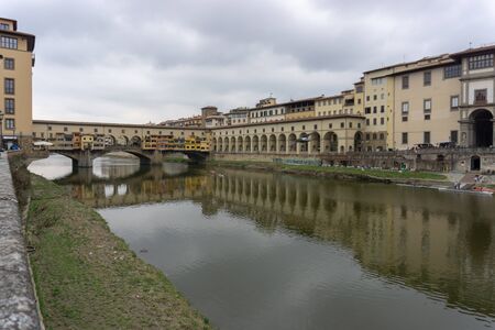 Ponte Vecchio the famous Arch bridge in Florence on Arno river, Tuscany, Italyの写真素材