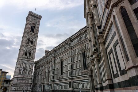 Details of Cathedral of Saint Mary of the Flower, called Cattedrale di Santa Maria del Fiore in Florence Tuscany from Uffizi Gallery. Also known Cathedral of Florence or Duomo Di Firenze.の写真素材