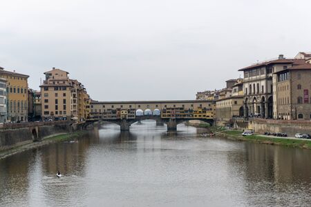 Ponte Vecchio the famous Arch bridge in Florence on Arno river, Tuscany, Italyの写真素材