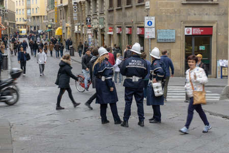 Florence, Italy - March 1, 2019: A police officer talking on the street near Ponte Vecchioのeditorial素材