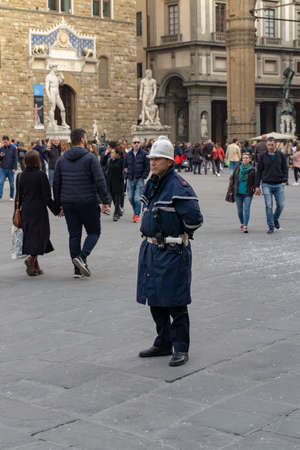 Florence, Italy - March 2, 2019: A police officer on Piazza della Signoria in Florenceのeditorial素材
