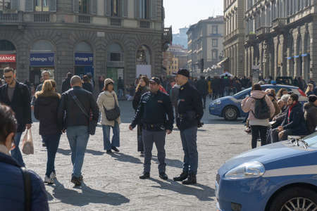 Florence, Italy - March 3, 2019: A police officer with car on Piazza della Signoria in Florenceのeditorial素材