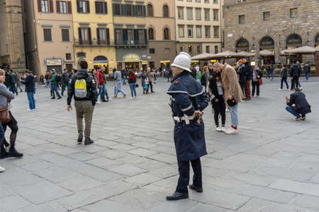Florence, Italy - March 2, 2019: A police officer on Piazza della Signoria in Florenceのeditorial素材