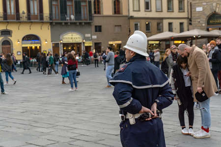 Florence, Italy - March 2, 2019: A police officer on Piazza della Signoria in Florenceのeditorial素材