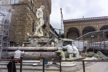 Florence, Italy - March 1, 2019: Restoration of the Neptune fountain on Signoria square, Florence, Italyのeditorial素材