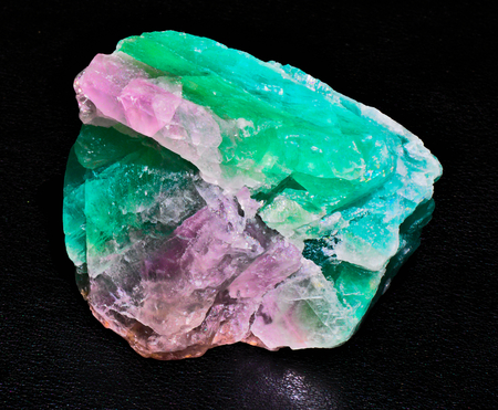 fluorite green magenta transparent mineral crystal gem stone black backgroundの写真素材