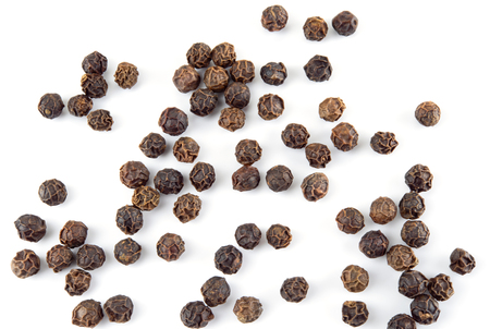 Peppercorn isolated on white background. Dry black pepper seeds. Top view.の写真素材