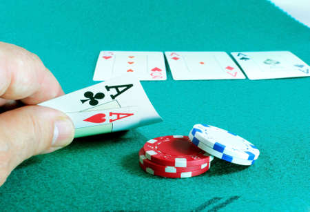 Winning poker hand on mat green. French deck.