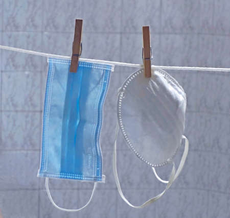 Two sanitary masks stretched out to dry the moisture