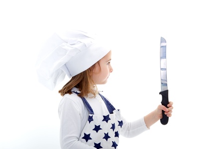 child chef cook with kitchen knife in a white backgroundの写真素材