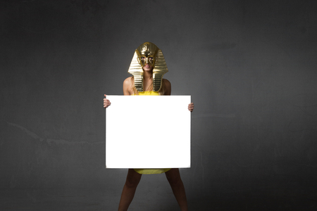 pharaoh woman with white empty board, advertising conceptの写真素材