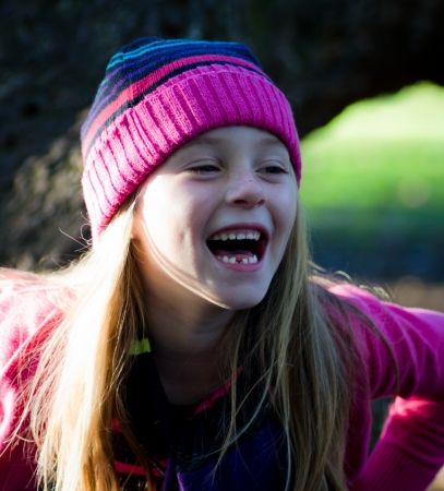 portrait of little girl with fall clothes in natureの写真素材