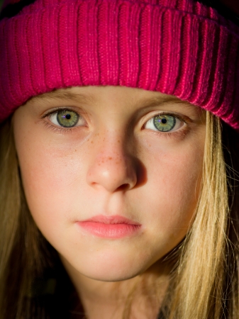 portrait of little girl with fall clothes in natureの写真素材