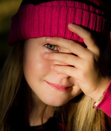 portrait of little girl with fall clothes in natureの写真素材