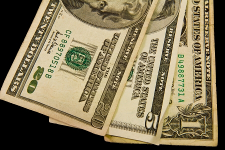 three dollar bills isolated on blackの写真素材