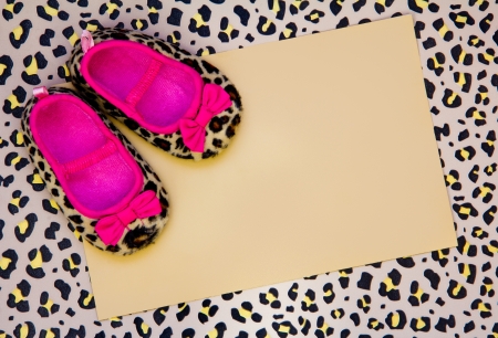 blank baby shower invite with leopard shoes and frameの写真素材
