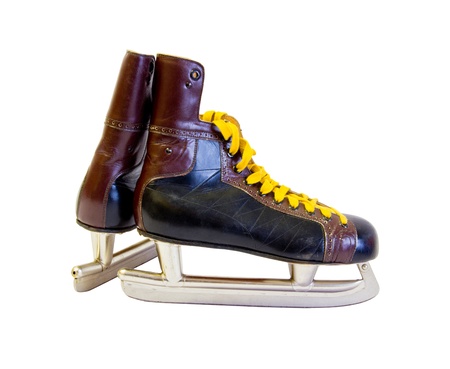 old ice skates with yellow cordageの写真素材